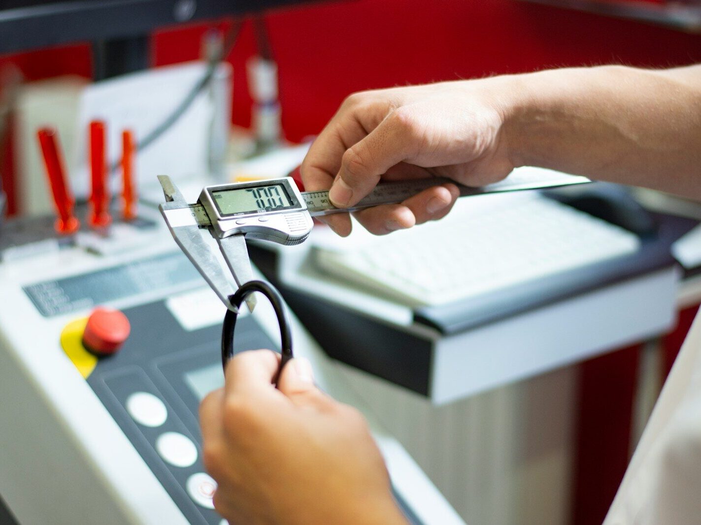 a person using a calculator on a machine